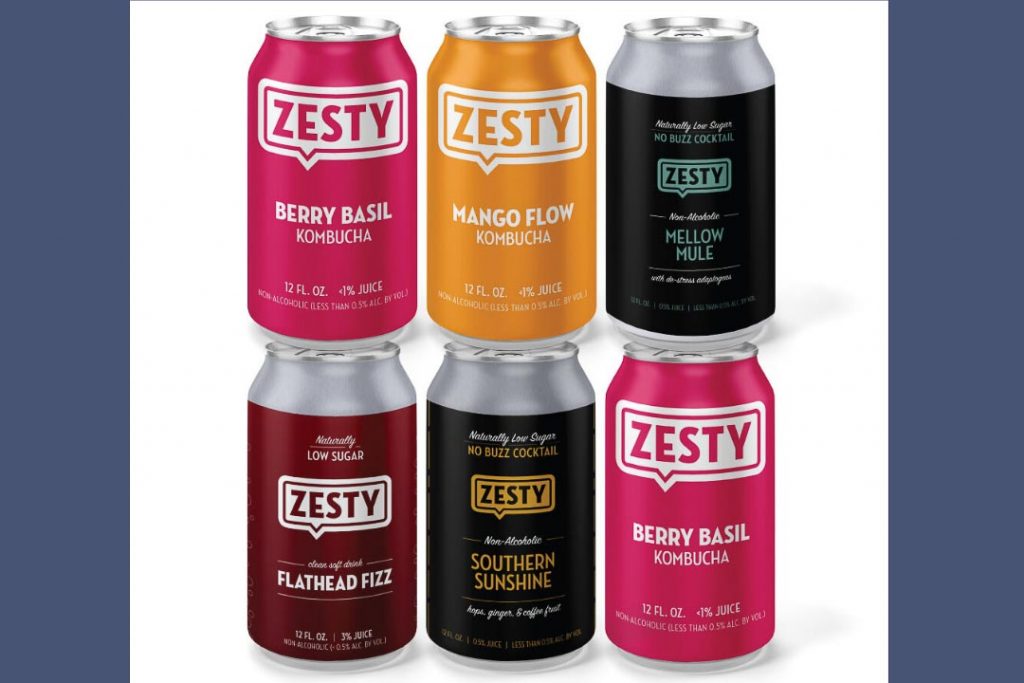 Stack of six aluminum cans with colorful labels that read "Zesty."