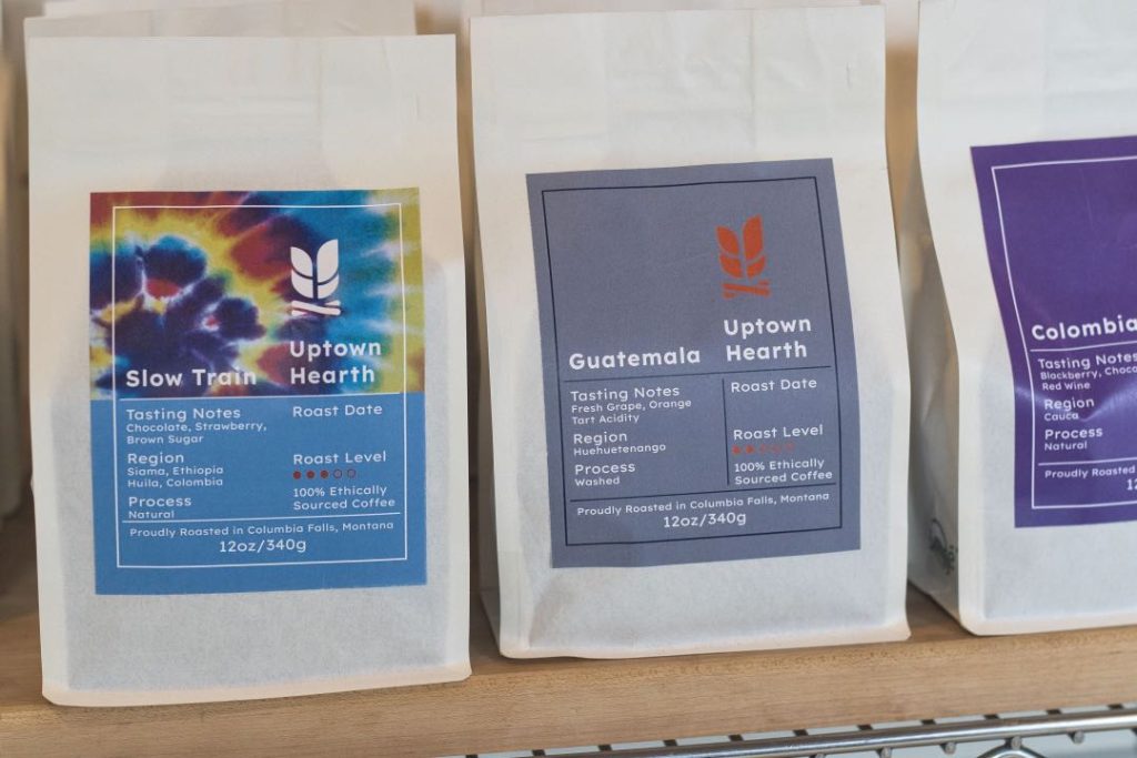 White coffee bags with colorful labels.