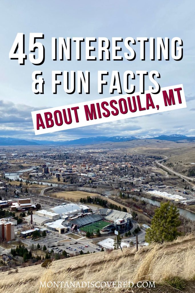 Looking down from a grassy hillside onto a busy cityscape. A football stadium is in the foreground. Overlaid on the photo is a caption in white and red text that says "45 Fun and Interesting Facts about Missoula, MT".