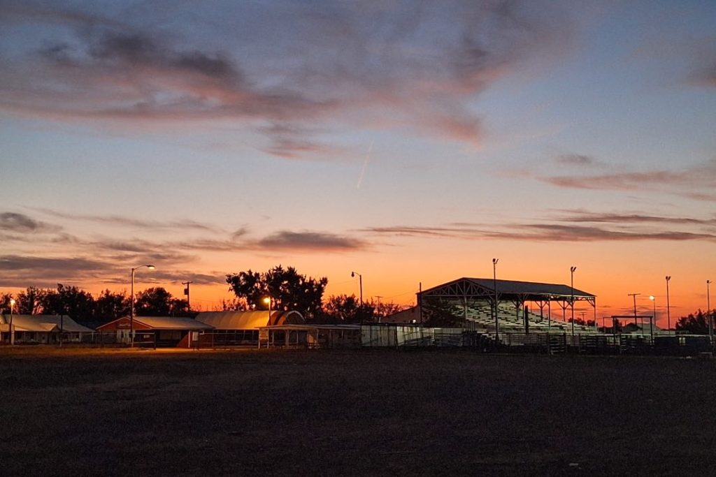 Horse racing grand stands silhouetted by the sunset.