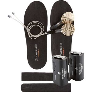 A pair of ski boots insoles sit next to a a pair of wires with small pads at the ends of them. A pair of USB battery packs are also shown.