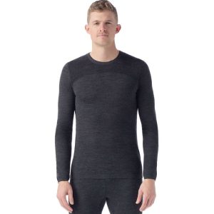 A white man with light brown hair wearing a matching black baselayer set.