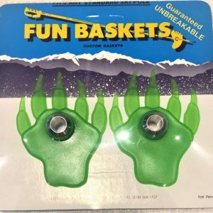 A package with a pair of green ski pole baskets shaped like bear paws.