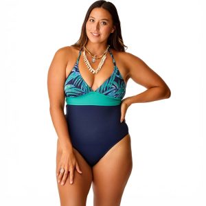 A women wearing a teal and navy one-piece swimsuit.
